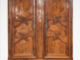 an antique wooden armoire with carvings and carvings on the doors