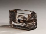 a silver and black ring with a design on it