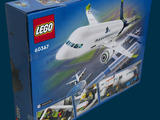 a box with a lego airplane in it on a blue background