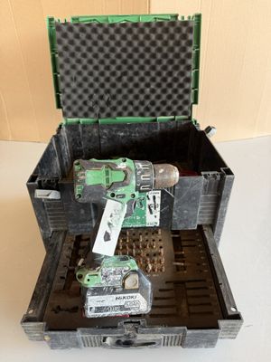 a tool in a case with a screwdriver inside of it