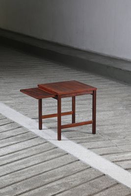 a small table that is sitting on the concrete floor