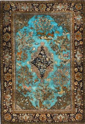a blue and brown rug with a medallion design on it