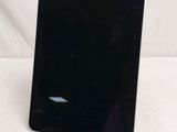 an image of a black tablet computer sitting on top of a white table