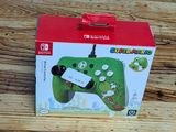 a nintendo wii controller in a box on a wooden table
