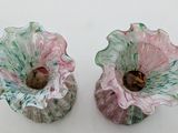 two vases that are sitting next to each other on a table