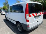 a white van that is parked in a parking lot