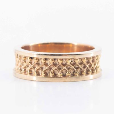 an image of a gold ring with a pattern on it