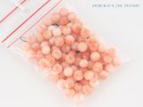 a bag full of peachs sitting on a table