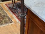 a floor lamp that is sitting in a room