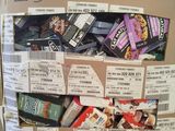 a cardboard box full of food items on a pallet