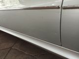 a close up of a car door handle and door handle