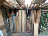many pieces of wood stacked on top of each other in a room