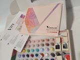 a box of watercolors sitting on a white table