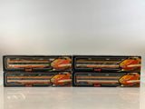 three orange and white train cars sitting on top of each other
