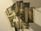 a pile of old postcards on a table