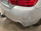 a car that has been dented and is parked in a garage