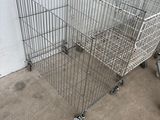 a metal shopping cart that is sitting on the ground