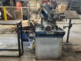 two machines that are sitting in a warehouse