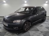 a picture of a dark colored car parked in a garage