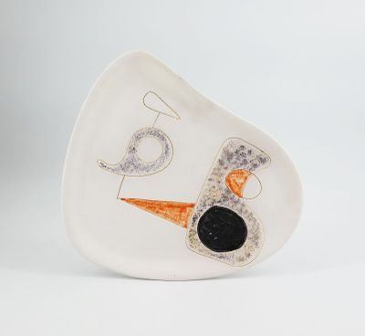 an image of a white plate with an orange and black design on it