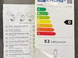 a close up of a book on a table next to an energy label
