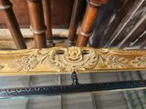 a glass table with a gold leaf design on it