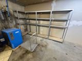 an image of a garage with shelves and a blue machine