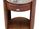 a round table with a glass top and a wooden base