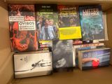 many books in the box on the shelf