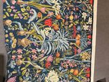 a close up of a tapestry on a chair in a room