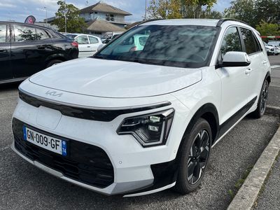 the white suv is parked in the parking lot next to other cars