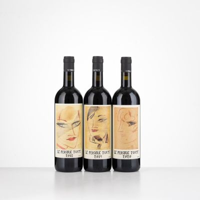 three bottles of wine with a drawing of a woman ' s face on them
