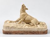 une image représentant une sculpture de chien sur un rocher