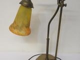 a lamp that is sitting on a table next to a wall