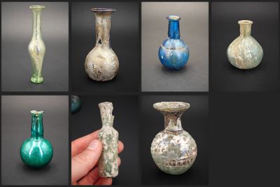 many different colored glass vases on display in this photo