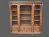an image of a wooden bookcase with glass doors and drawers