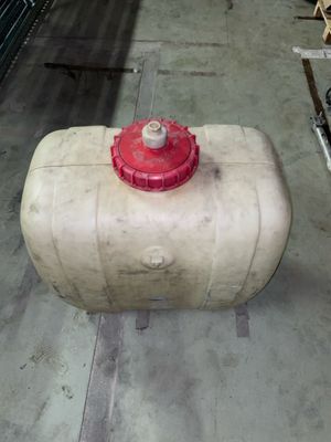 a red fire hydrant sitting on top of a cement block