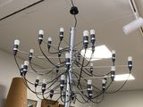 a chandelier that is hanging from the ceiling in a room