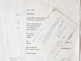 several papers are stacked on top of each other on a table