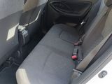 a seat in the back of a car with a seat belt