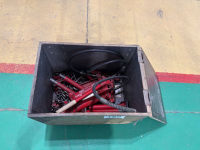 a box full of electrical tools on the floor