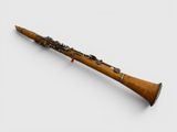 a close up of a bassoon on a white surface