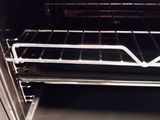 an open oven door with a rack in it