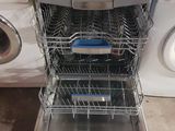 a dishwasher and a dryer in a kitchen