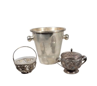 a silver ice bucket and a silver teapot on a white background
