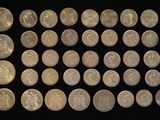 an image of a bunch of coins sitting on top of a black surface