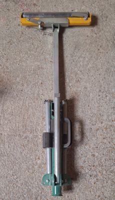 a razor on the floor next to a toothbrush on the floor