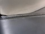 a close up of a piece of paper on top of a refrigerator