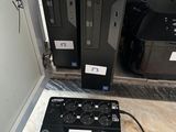 two computers that are sitting on the floor next to each other