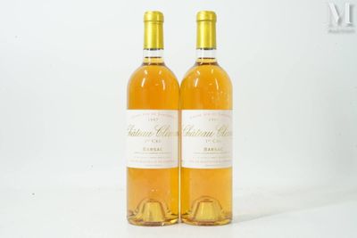 two bottles of wine sitting next to each other on a table